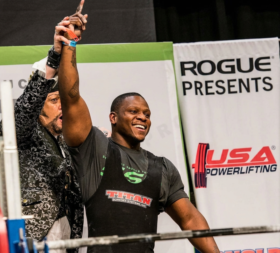 Dexter Jones celebrating a successful lift at a USA Powerlifting competition